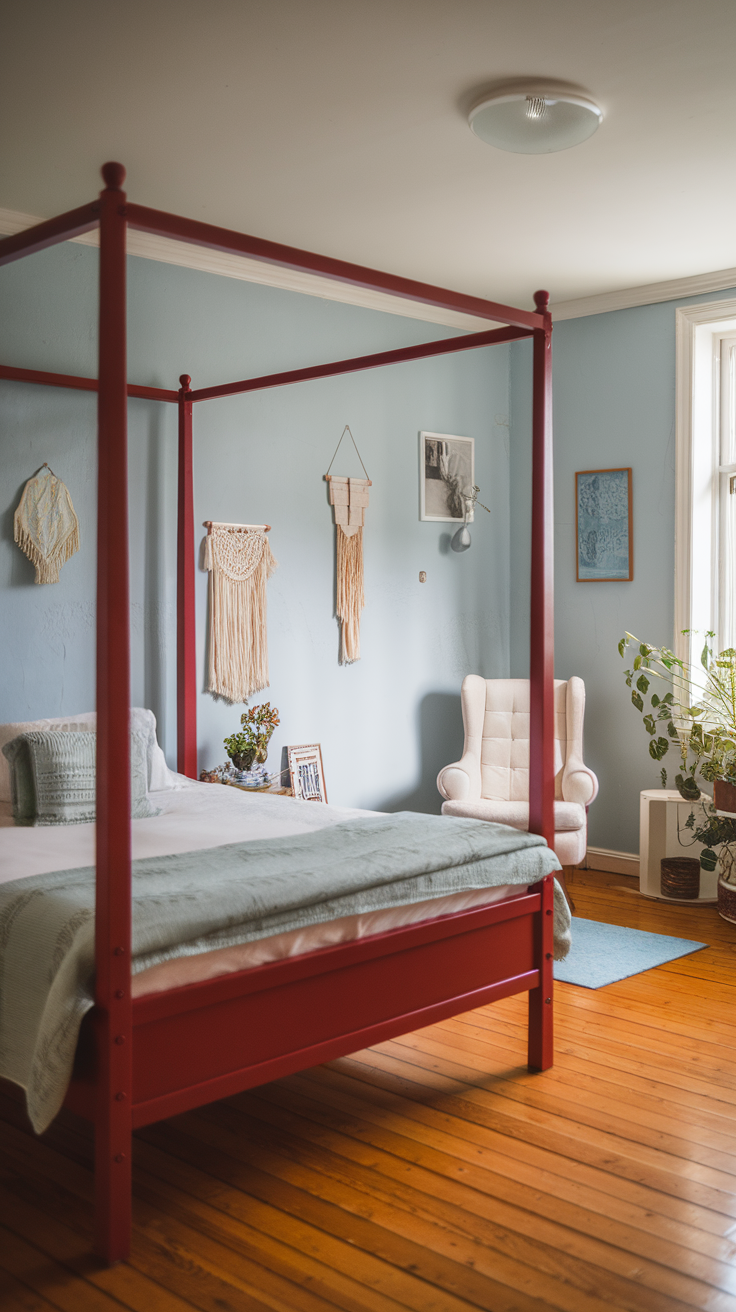 A bright red four-poster bed in a simple, cozy bedroom with light blue walls and natural wooden flooring.