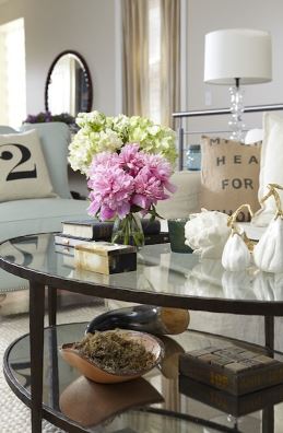 a well designed oval glass coffee table